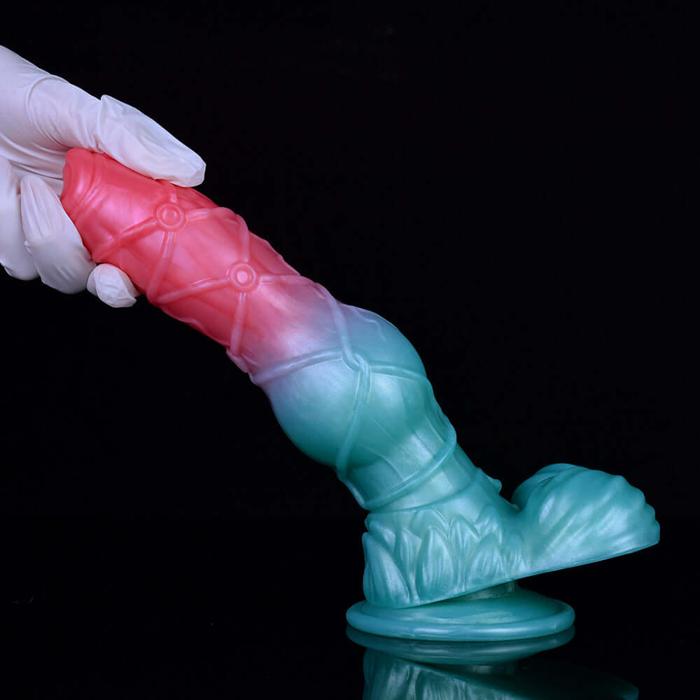 Two-tone pink-and-teal fantasy dog alien sex toy, knotted shaft with ridged texture
