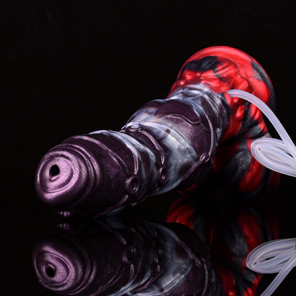 Close-up of purple-and-silver alien dildo with red base and clear suction tube