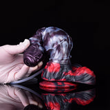 Alien-themed squirting dildo with red flared base and attached clear tube