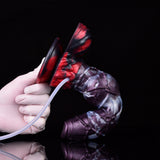 Alien-themed squirting dildo side view with attached tube