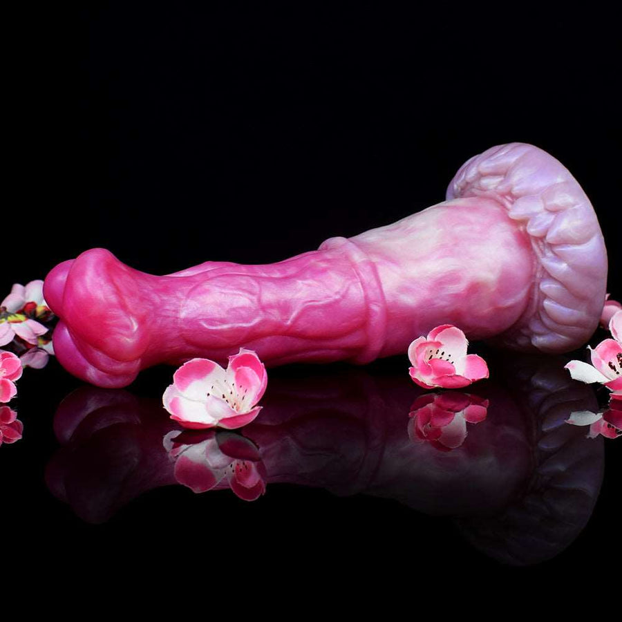 Pegasus-shaped adult toy with floral decor around base; pink glossy, reflective look.