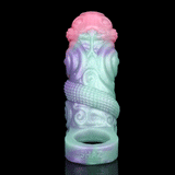 Pastel silicone alien sleeve extender standing upright with open cup at base