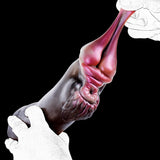 Rabbit-shaped sex toy held by gloved hands; pink face and dark gray body