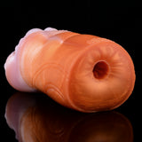 Orange outer end with circular opening, dual-hole canine fleshlight