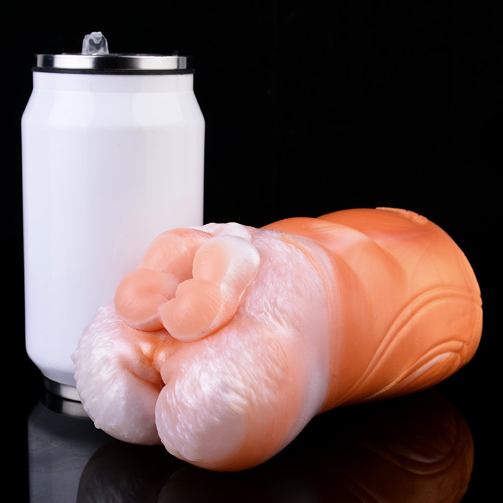 Dual-hole fleshlight with white canister behind; orange and pale pink exterior
