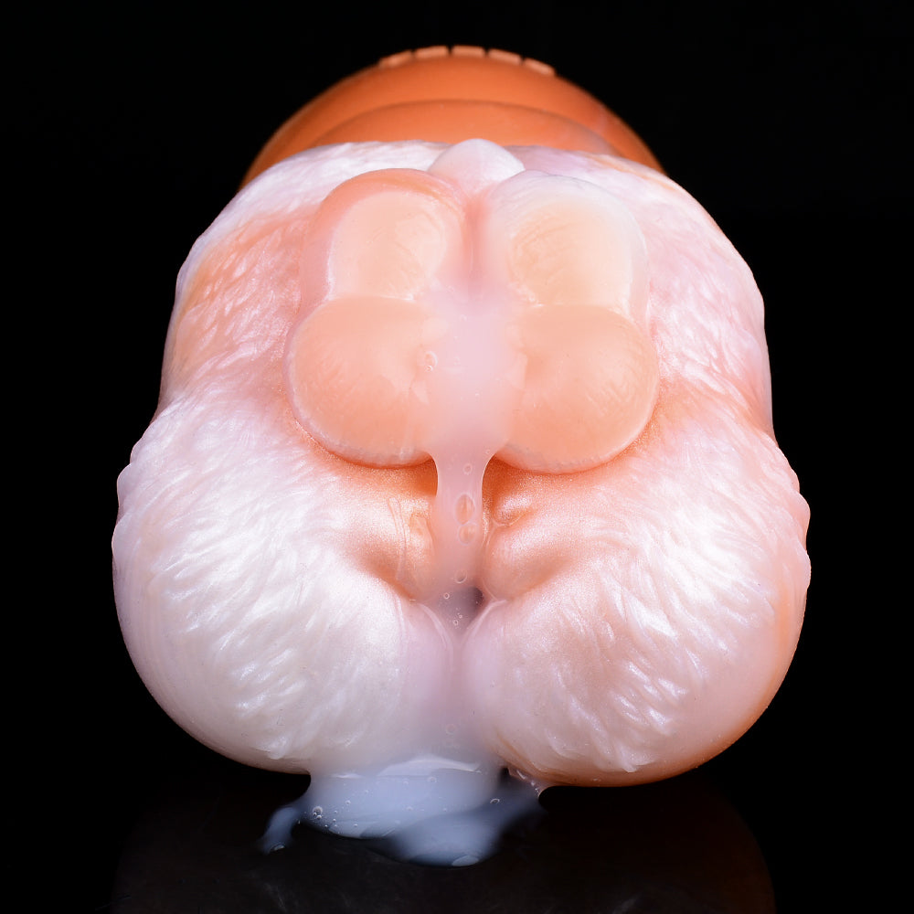 Close-up of dual openings on pale pink, textured canine fleshlight