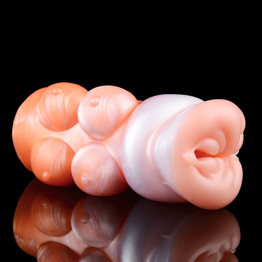 Orange and white dog-themed masturbator showing side profile and curled internal detail