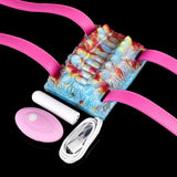 Octopus vibrating grinder with pink straps and white wand, multicolor texture
