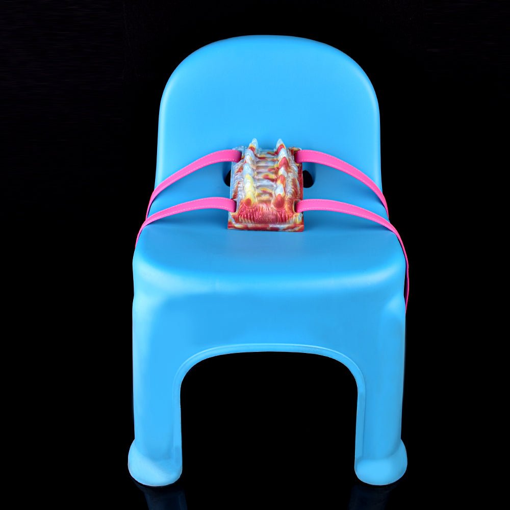 Octopus vibrating grinder toy with pink straps, multicolor textured front