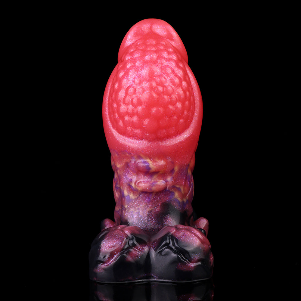 Rear view dragon knot butt plug, textured pink top with purple scaled midsection
