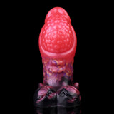 Rear view dragon knot butt plug, textured pink top with purple scaled midsection
