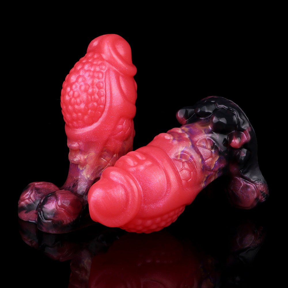 Side view dragon knot butt plug, textured pink-scaled body and black base ends