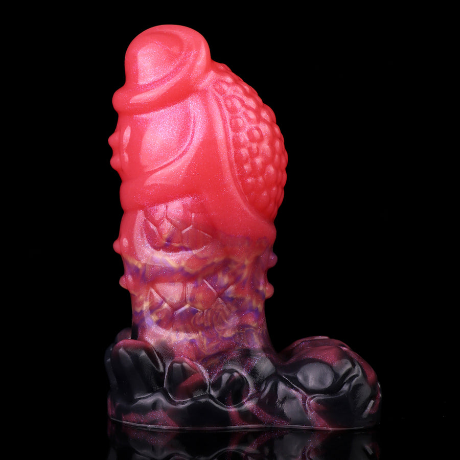Pink dragon-themed anal butt plug front view with textured body and dark claw base.