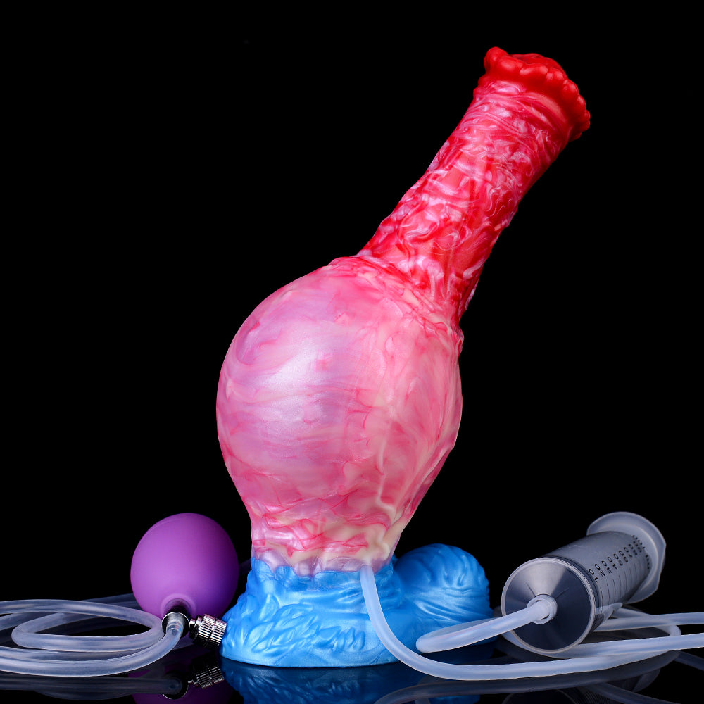 Angled view of pink expanding dildo, red ridged tip, blue base with air tubes