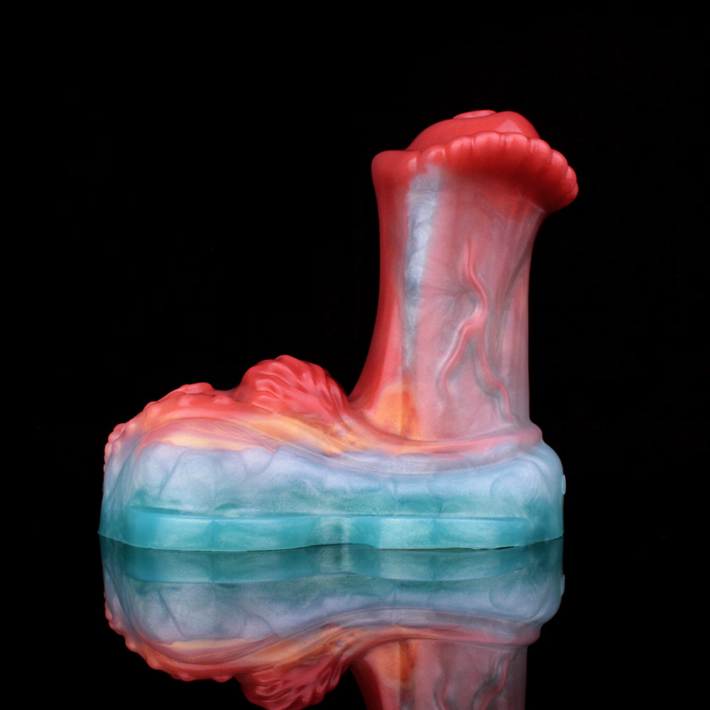 Horse cock grinder toy, close side view; blue base and red tip