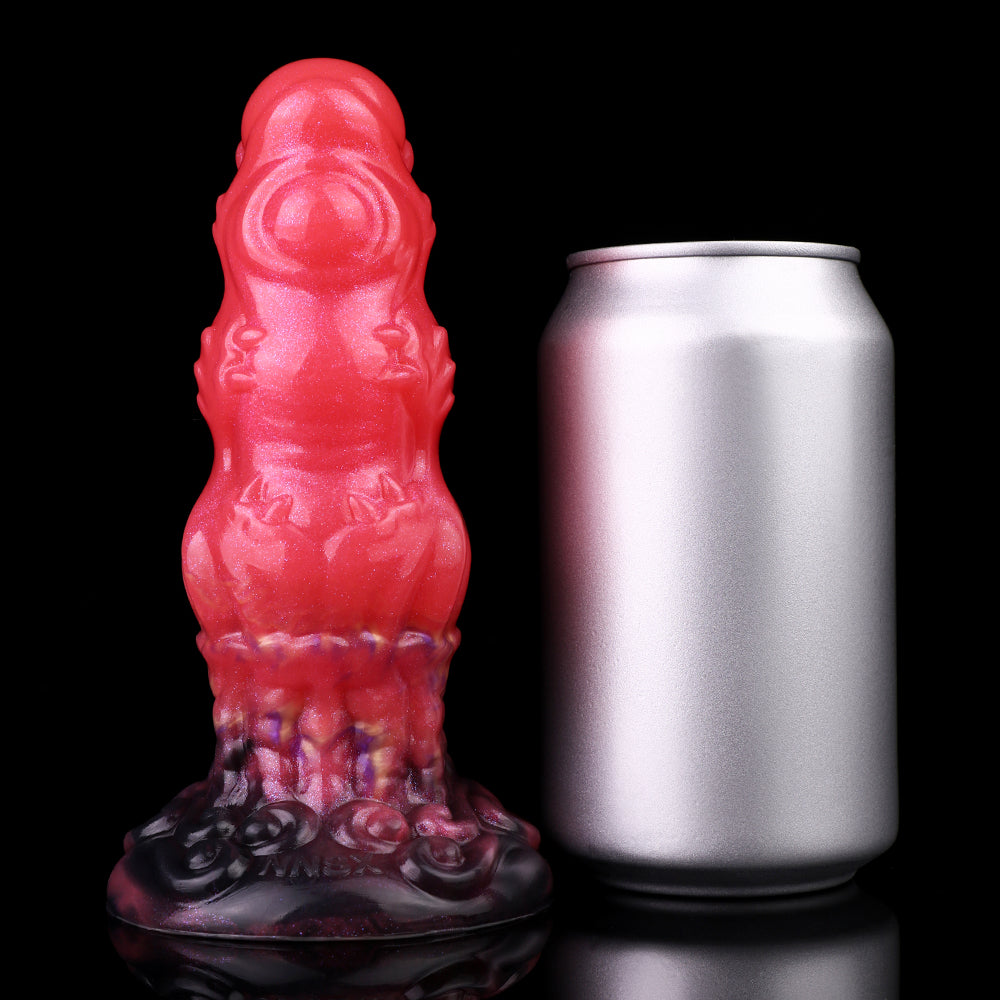 Alien butt plug front view; glossy red ribbed shape with textured dark purple base.