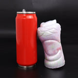 Fantasy masturbator with white and pink exterior, next to red can
