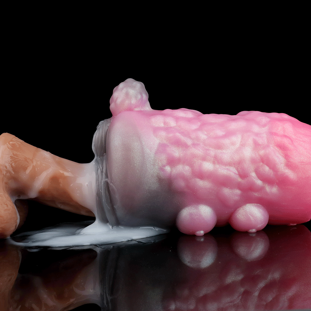 Pink and light-purple animal-themed sex toy with textured body and rounded bumps