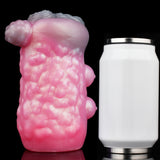 Pink animal-themed sex toy front view with textured surface and three rounded protrusions