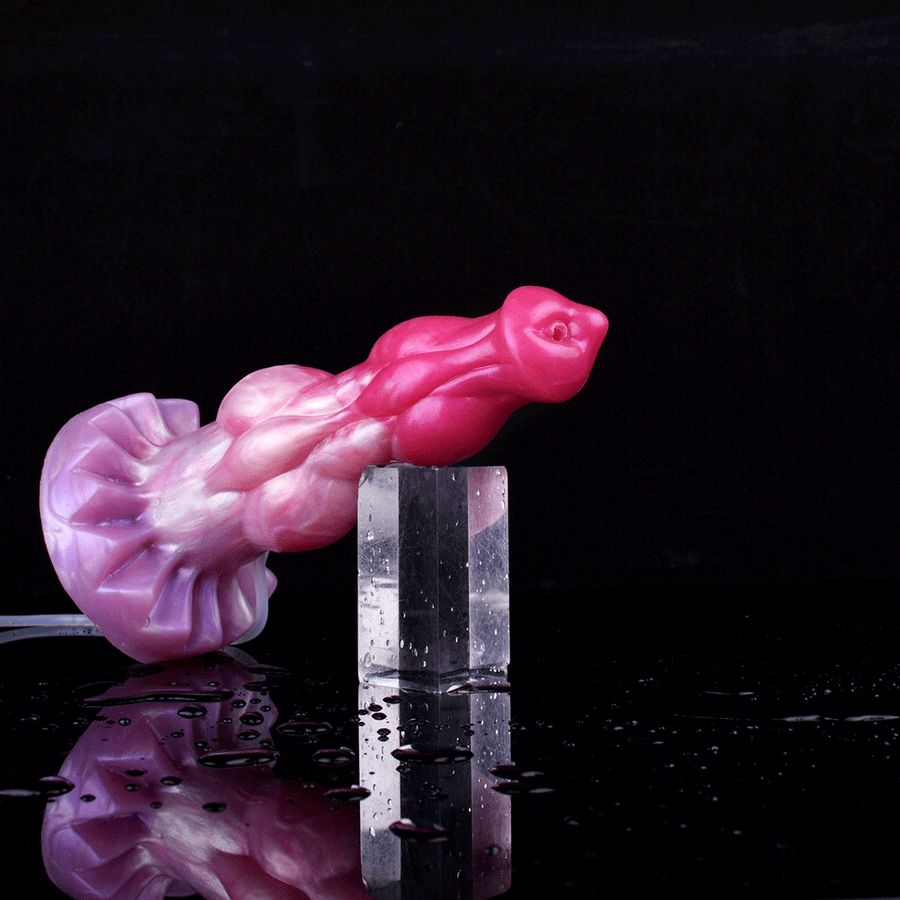 Fantasy minotaur-shaped squirting dildo with nozzle, spraying water onto a dark block