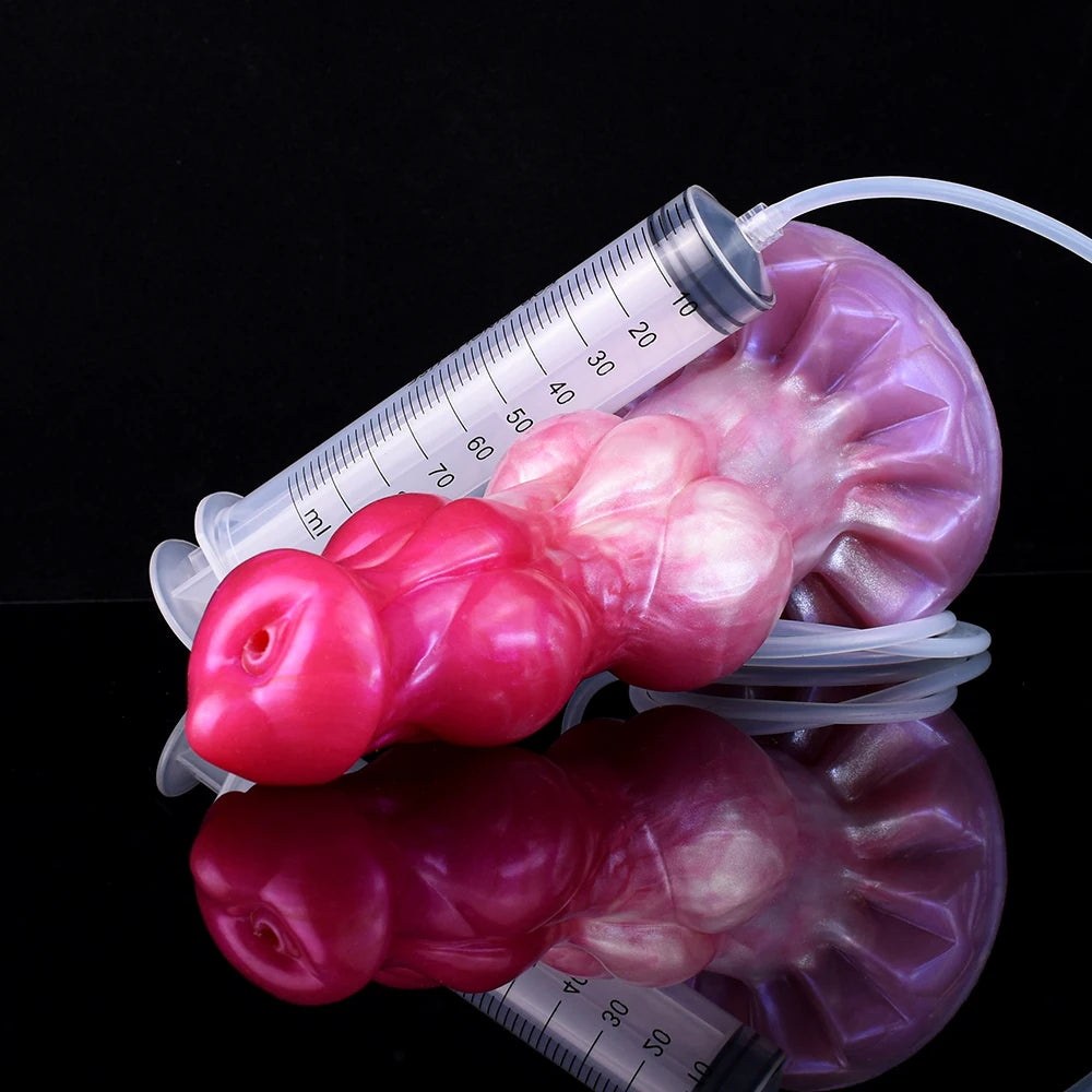 Minotaur squirting dildo with measuring syringe, pink-purple, close-up with droplets