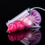 Minotaur squirting dildo with measuring syringe, pink-purple, close-up with droplets