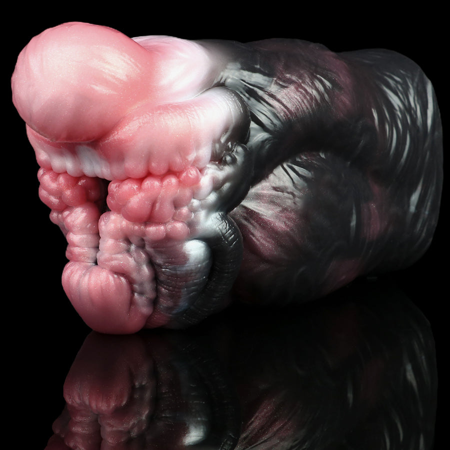 Monster muzzle masturbator side view with pink inner ridges and dark outer sleeve