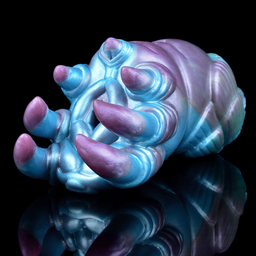 Alien claw stroker masturbator, blue and purple, angled view with claw pads