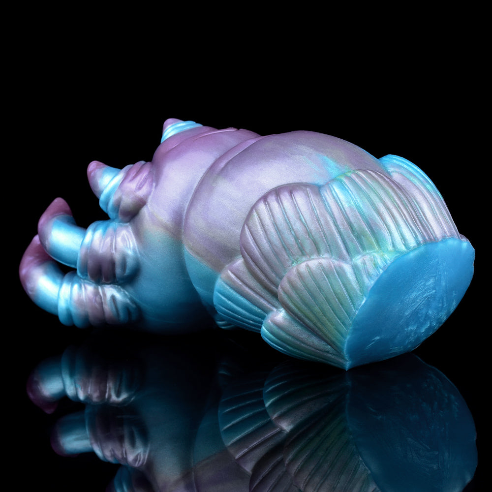 Alien claw stroker back view: ribbed shell with blue end and claw details