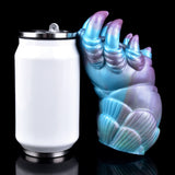 Alien claw stroker beside white storage cup with metal rim