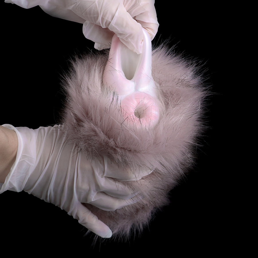 Lilac fuzzy two-opening sleeve held open, showing two white openings