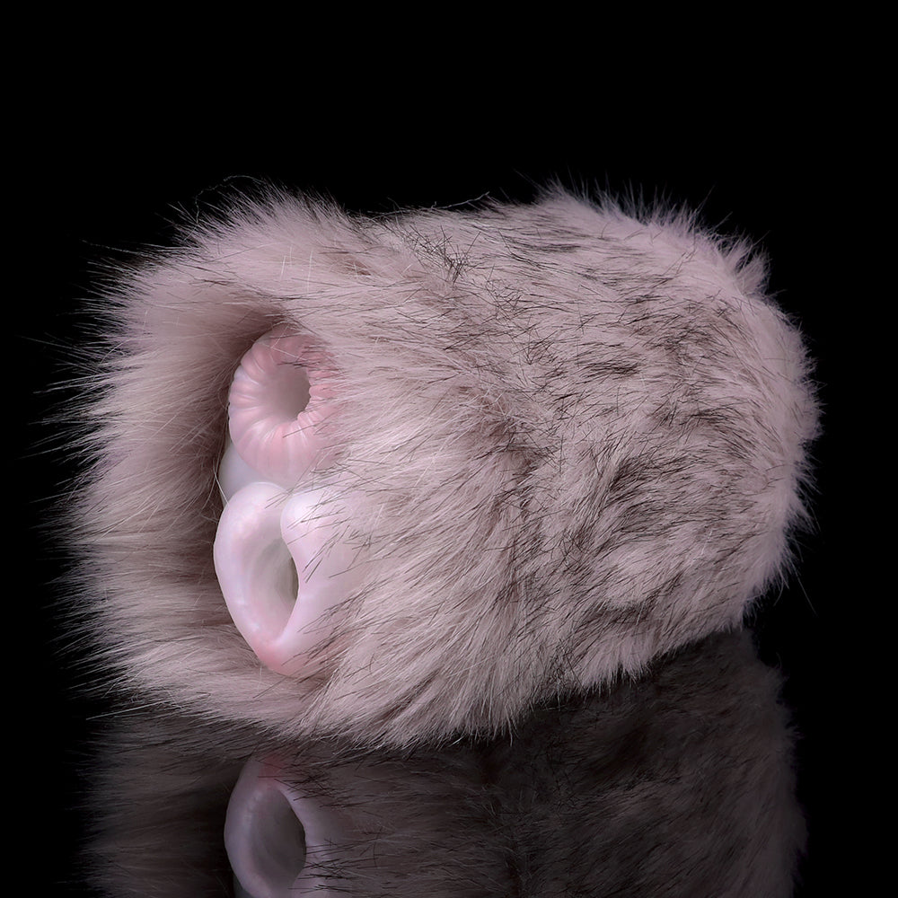 Angled view of furry two-hole stroker with two pink openings