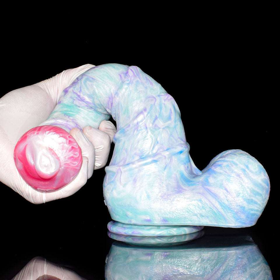 Close-up of curved horse dildo, pink head, pastel blue body, thick rounded base
