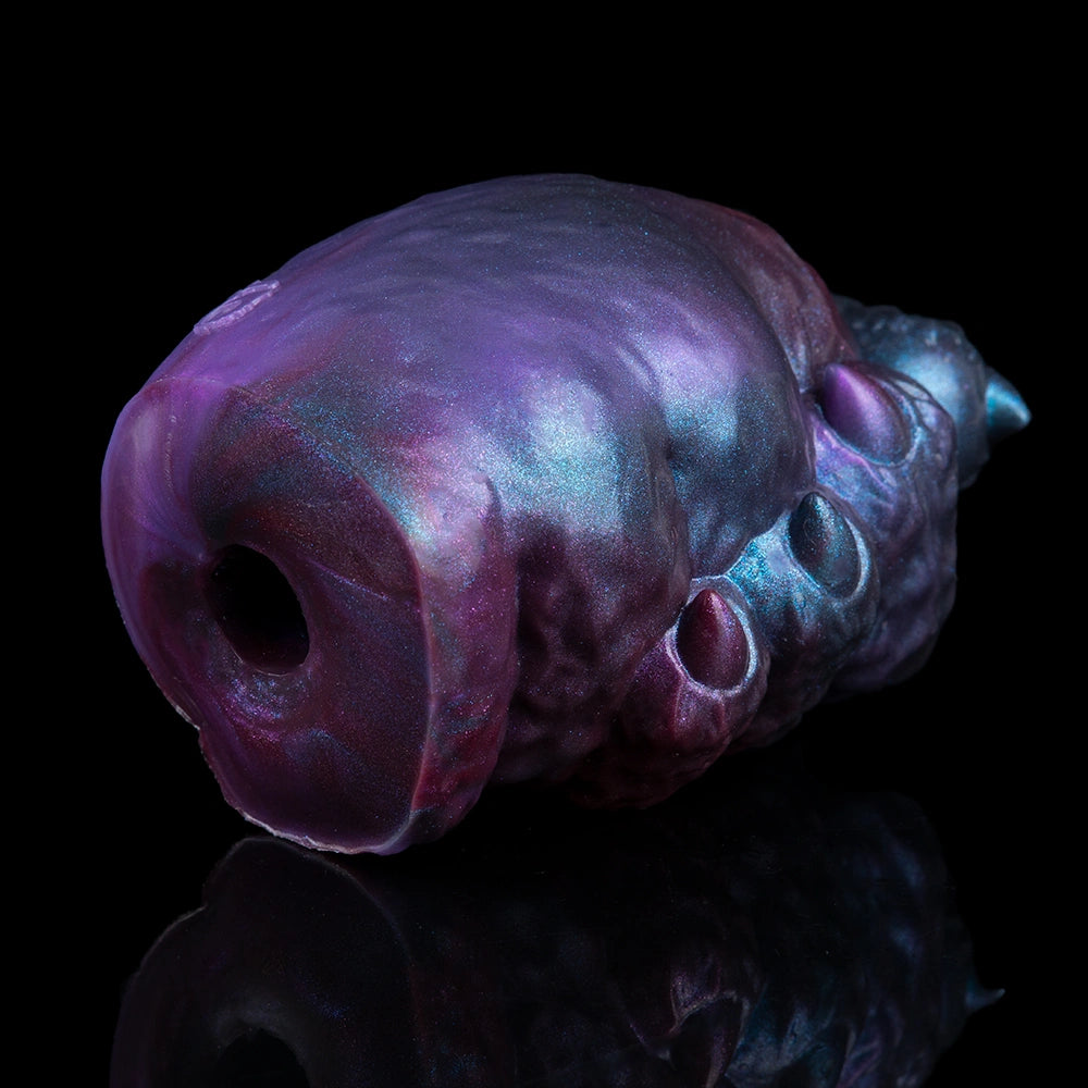 Purple and blue metallic alien monster masturbator with side hole and textured surface.