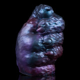 Curved blue-purple metallic alien monster masturbator with rounded base and front details.