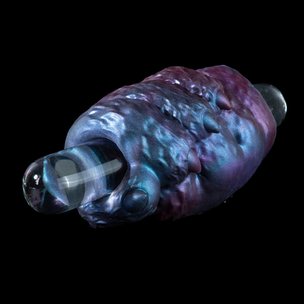 Blue-purple metallic alien monster masturbator with open tip and side ring detail.