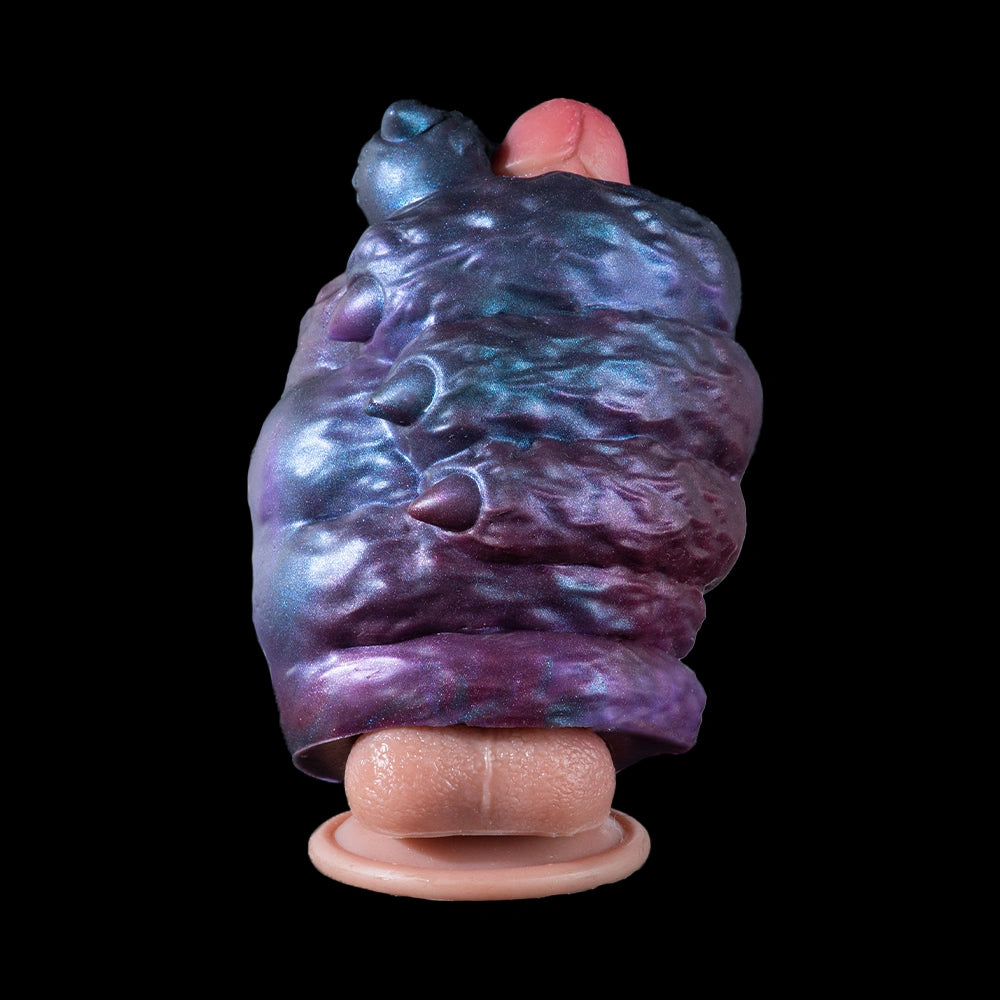 Alien monster masturbator with blue-purple metallic body and pink suction base.