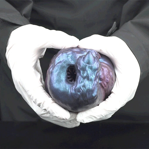 Alien monster masturbator in white gloves, blue-purple metallic head facing forward.