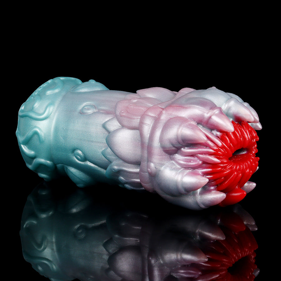 Alien male stroker, side view with teal and pale blue body, red inner core tentacles