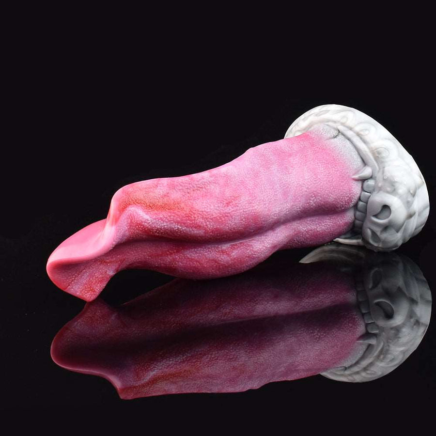 Pink textured wolf-tongue dildo close side view with white base and curled tip