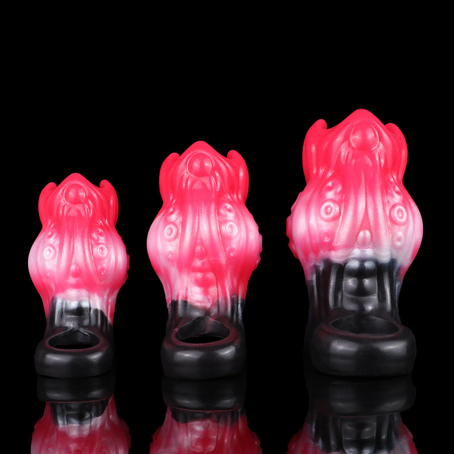 Three monster knot cock rings in pink with black band, side angles shown.