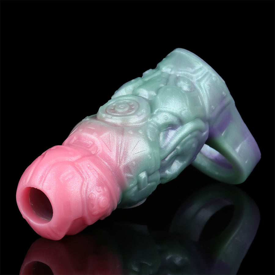 Alien penis sleeve extender close-up, pink tip and greenish-purple creature body