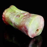 Two-hole dragon fleshlight end view, pale green body with pink accents