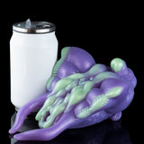 Purple alien figurine with curled body, webbed limbs, and light green accents