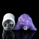 Purple alien figurine with purple texture and small green feet, side view