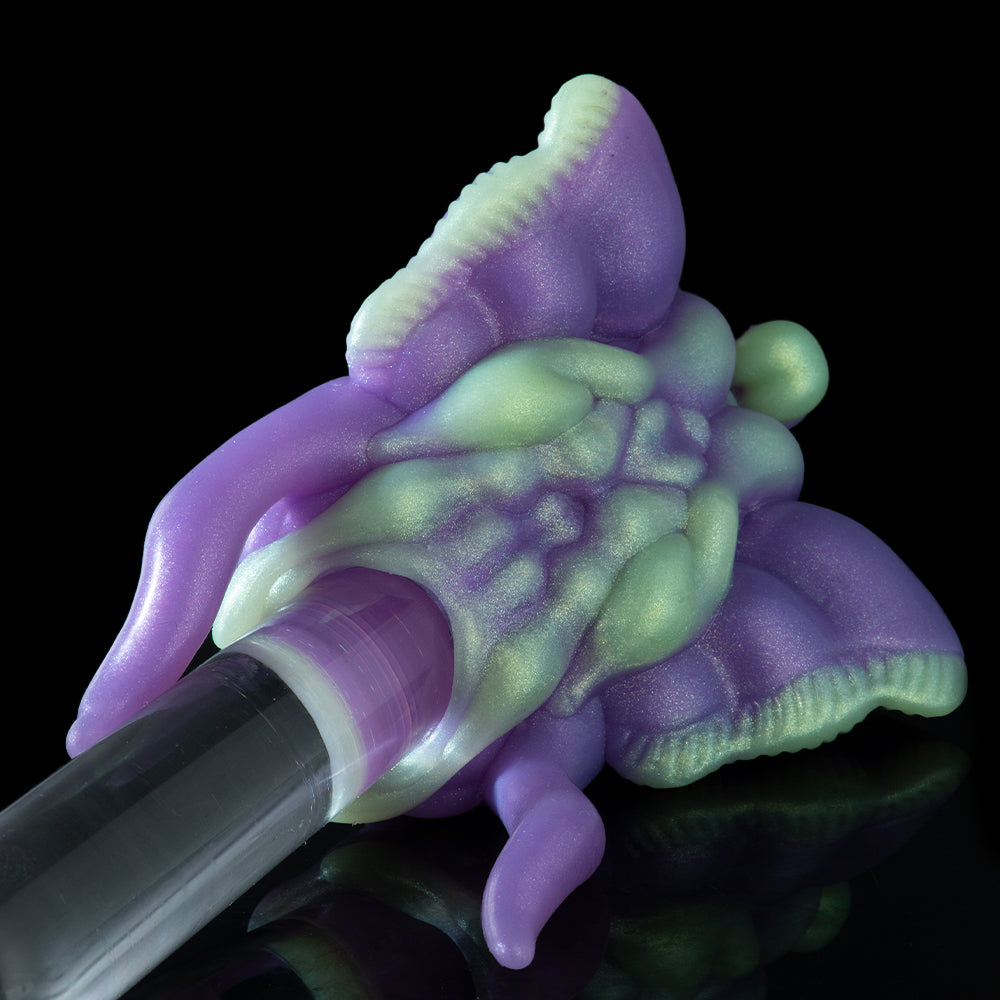 Purple and green 3D toy figure with clear cylindrical handle