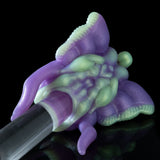 Purple and green 3D toy figure with clear cylindrical handle