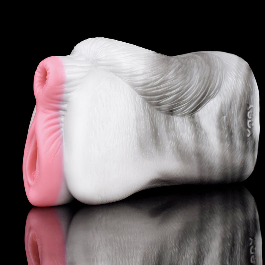 Side profile of white masturbator with pink opening; textured exterior visible.