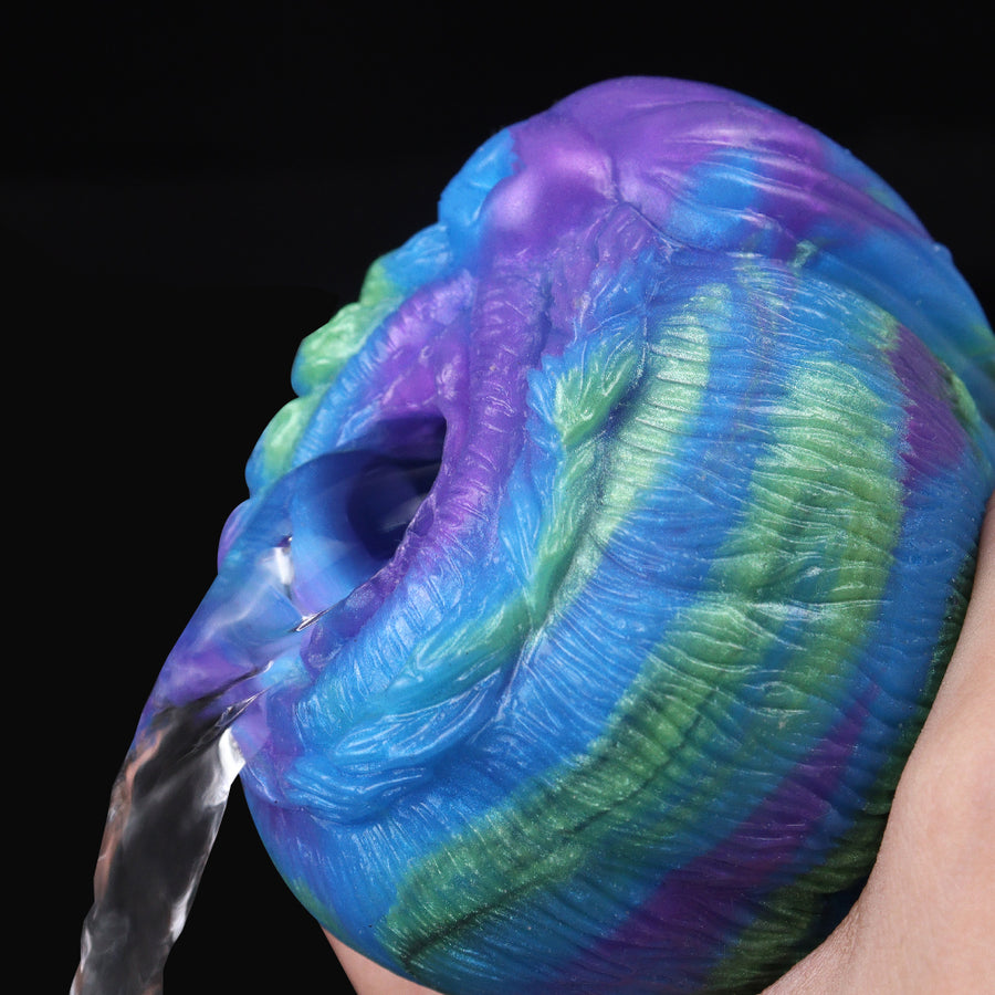 Rainbow harpie-style masturbator close-up, open center on blue-purple-green textured body