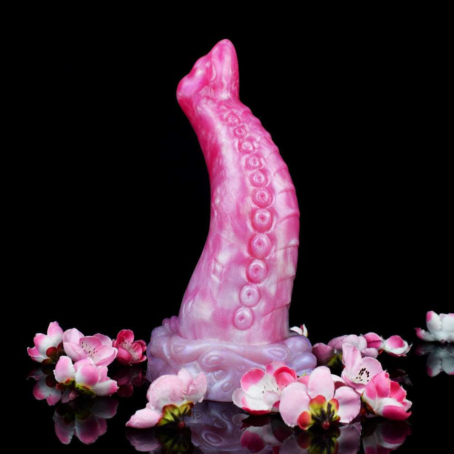Curved octopus-tentacle butt plug with tall flared base, translucent pink and light lilac details.